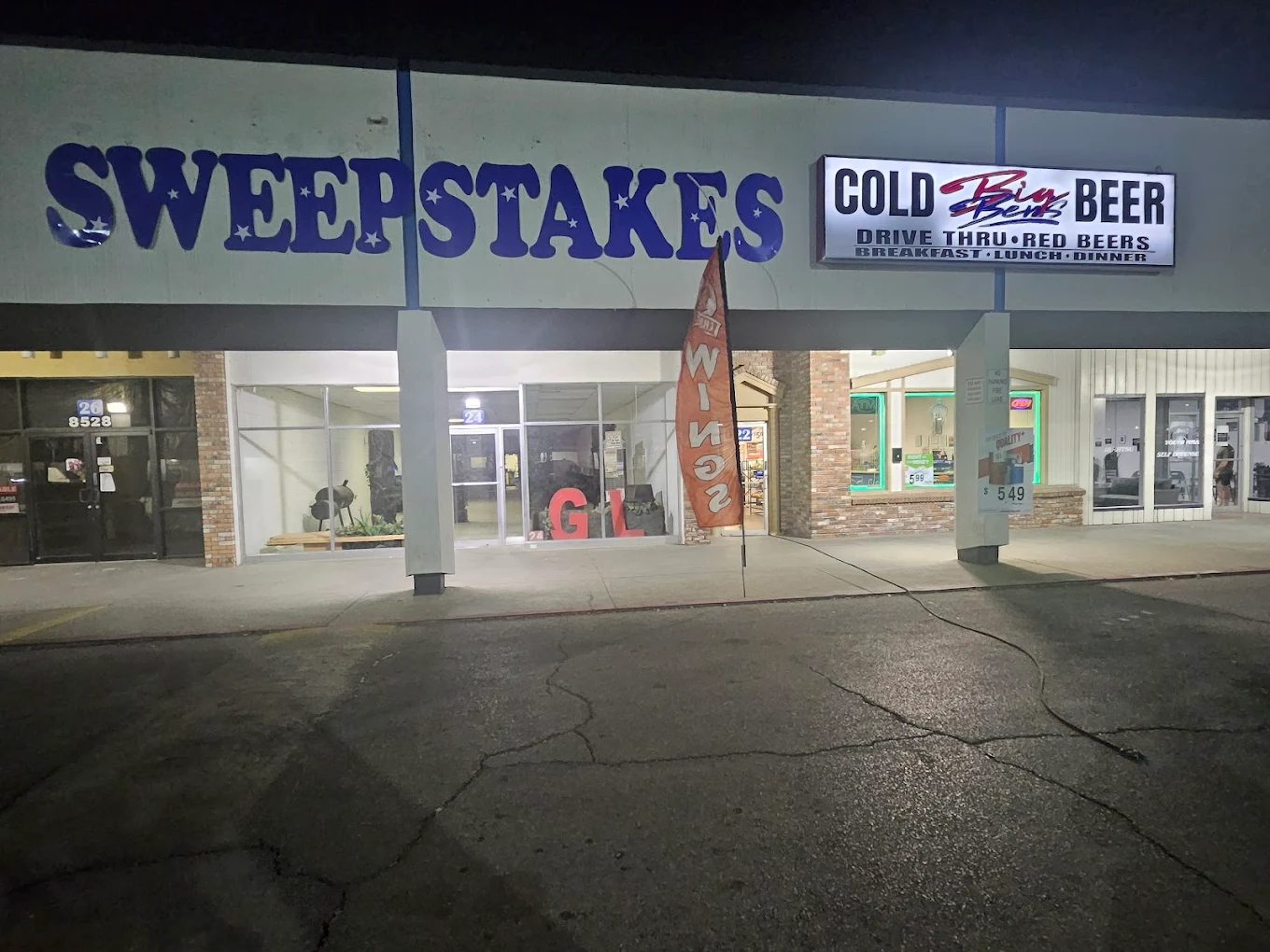 Sunrise Mini Mart storefront at night on Dyer Street